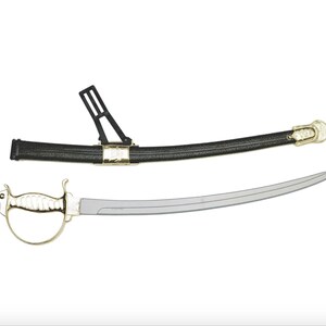 May include: A curved sword with a polished silver-tone blade and a gold-tone hilt featuring a hand guard. The accompanying black scabbard has a textured finish, gold-tone metal accents, and a black plastic belt attachment loop for carrying.