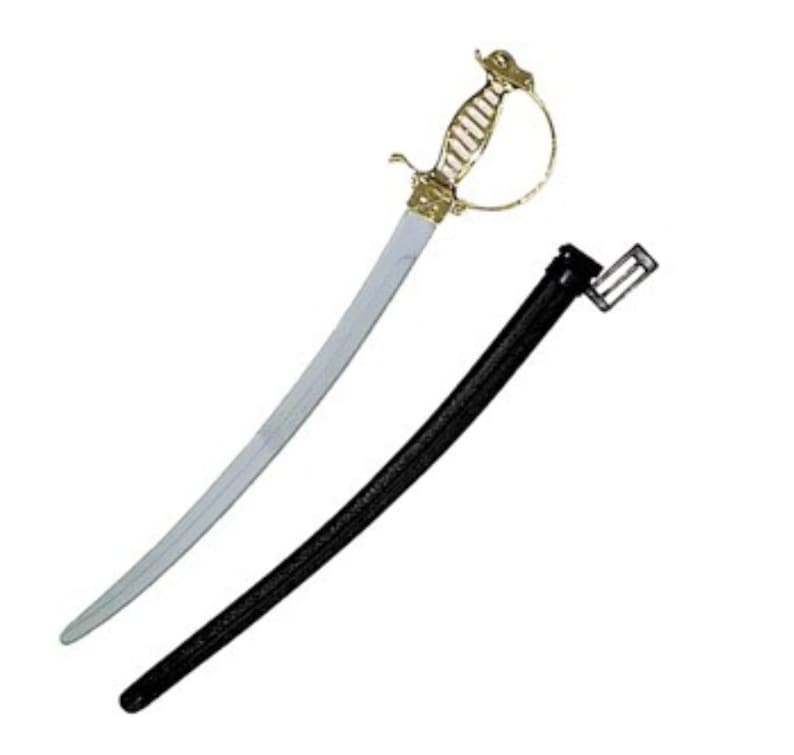 May include: A curved sword with a metallic silver blade and a gold-colored hilt featuring a protective hand guard. Beside the sword is a long, black scabbard with a rectangular attachment at the top, designed to hold the blade securely when not in use.
