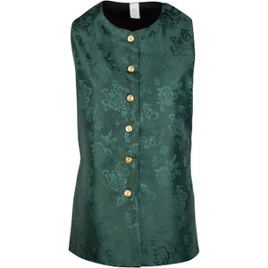 May include: A sleeveless vest in a deep emerald green color featuring a tonal floral jacquard pattern throughout. The garment has a round neckline, a black interior lining, and a front button closure with five circular gold-toned metal buttons.