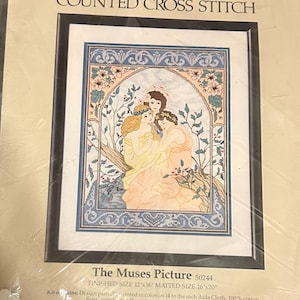 May include: A counted cross stitch kit of "The Muses Picture." The design depicts three figures in gowns, with floral and botanical details. The finished size is 30.48cm x 40.64cm and matted size is 40.64cm x 50.8cm. The kit includes design printed in colour on Aida cloth.