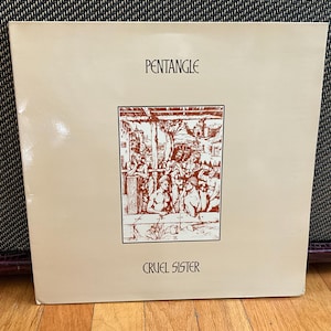 May include: A vintage vinyl record album cover featuring a black and white illustration of a group of people. The album is titled "PENTANGLE" and the song title is "CRUEL SISTER".