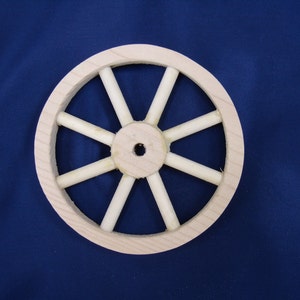 Handcrafted, 4" unfinsihed  pine wood wheel with eight spokes  Part No 1401-B