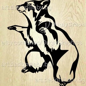 May include: Black and white graphic of a bear in a sitting position, with the text "etsy.com/shop/Dugly Graphics" and "art.design@abv.bg". The bear is stylized with sharp angles and lines, set against a light wood grain background.