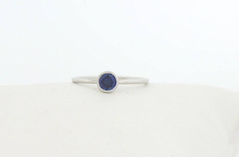 Round Blue Sapphire Bezel Ring Set In 14K Gold