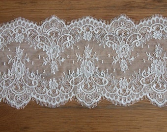 May include: White lace trim with a scalloped edge and intricate floral designs.