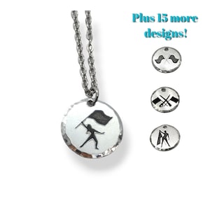 May include: Silver necklace with a round pendant featuring a silhouette of a color guard performer holding a flag. The pendant has a hammered texture.  Plus 15 more designs!