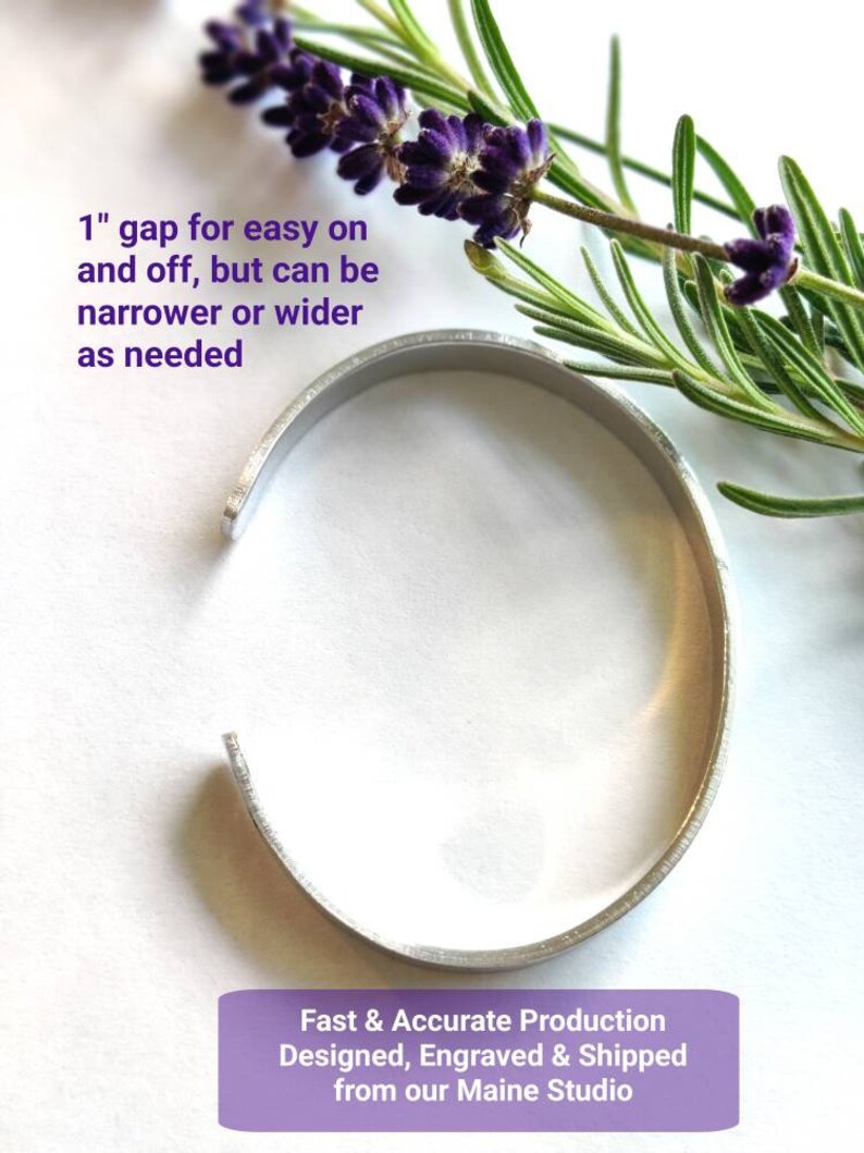 May include: A silver metal bangle bracelet with a 2.5 cm gap for easy on and off. The bracelet is on a white background with lavender flowers and rosemary.