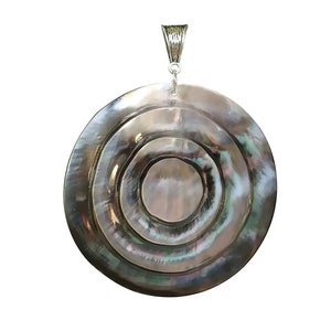May include: A round, silver-toned pendant with a concentric circle design made of iridescent black mother-of-pearl.