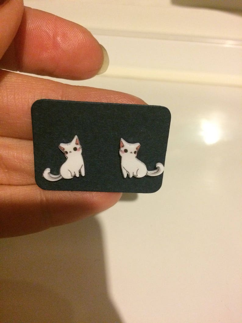 White cat earrings