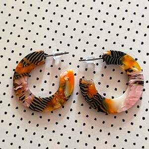 Acrylic hoop earrings peach, orange, black and white, multicoloured