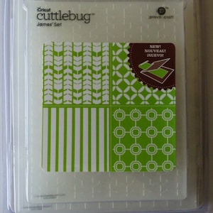 May include: Cricut Cuttlebug James' Set in a clear plastic package. The set features four green and white patterned designs, including chevrons, stripes, and geometric shapes. A brown sticker indicates "NEW!" in English, French, and Spanish.