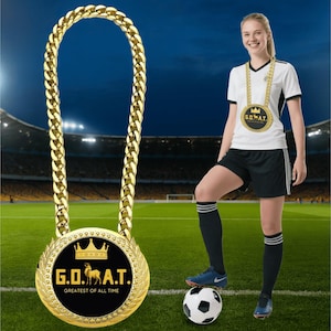 May include: A gold-colored chain necklace with a large pendant that reads "G.O.A.T. Greatest of All Time" with a crown and a goat illustration. A person wearing a soccer uniform stands on a soccer field with a soccer ball.
