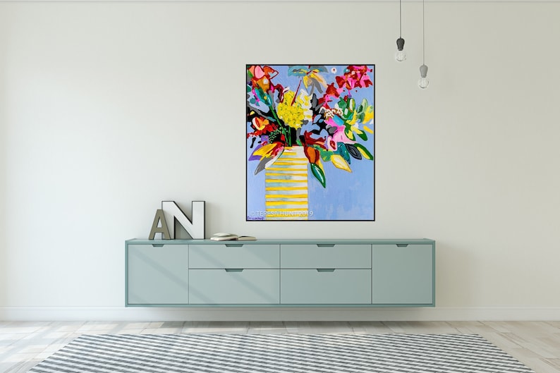 May include: A colorful abstract painting of a bouquet of flowers in a yellow striped vase against a light blue background.