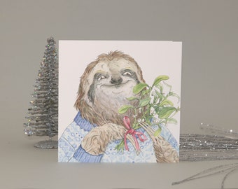 May include: A watercolor illustration of a sloth wearing a blue and white patterned sweater and holding a bouquet of mistletoe with a red ribbon.