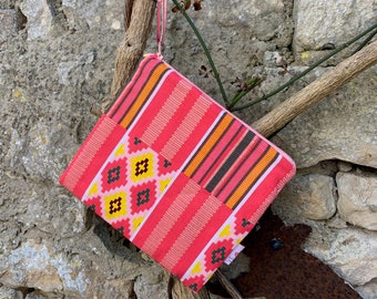 Flat kit or cotton pouch with Aztec motifs.