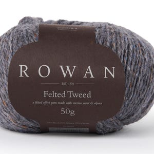 May include: A ball of gray yarn with brown flecks, labeled "ROWAN EST 1978 Felted Tweed a felted effect yarn made with merino wool & alpaca 50g"