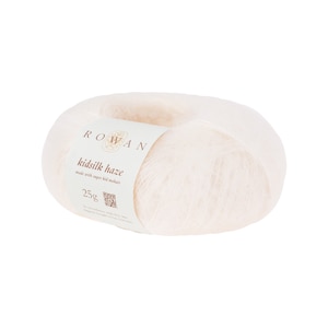May include: A ball of white Rowan Kidsilk Haze yarn, made with super kid mohair. The label reads "Rowan Kidsilk Haze made with super kid mohair 25g".