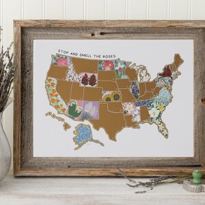 May include: A framed print of a map of the United States with each state illustrated with a different flower. The title of the map is "Stop and Smell the Roses".