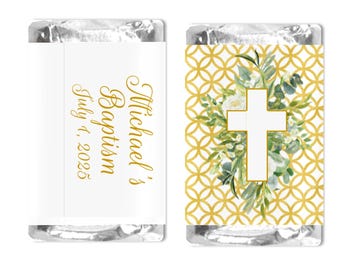 May include: Two wrapped candies. One has gold text that reads "Michael's Baptism July 1, 2025" on a white background. The other has a white cross with greenery on a gold geometric pattern.
