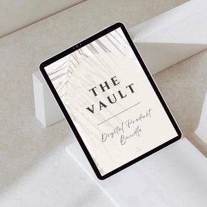 May include: A digital tablet displaying the text "THE VAULT Digital Product Bundle" in a minimalist design. The screen features a neutral color palette with a palm leaf graphic. The tablet is set on a white geometric stand against a neutral background.