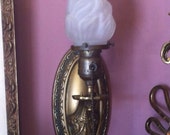 Early Twentieth Century Brass Electric Wall Sconce with Frosted Glass Torch Flame Light Shade
