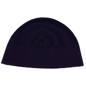 May include: A dark blue knitted beanie hat.
