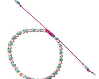 Dreamy gem crystals bracelet in blush pink and mystic turquoise on lilac string interspaced with gold-filled balls and fresh pearl surprise