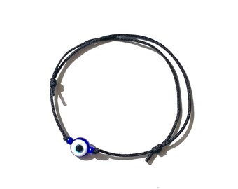 Blue evil on black string bracelet, Handmade-evil eye-gifts by Lucky Charms USA