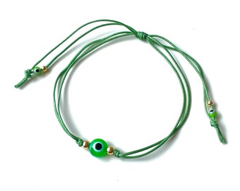 Green evil eye string bracelet with gold-filled accent beads by Lucky Charms USA