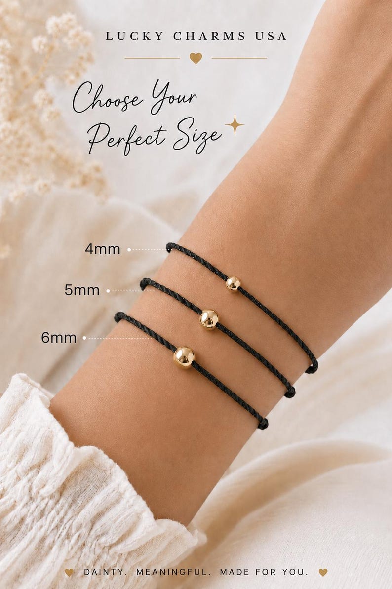 Black cord bracelet size comparison showing 4mm, 5mm and 6mm gold ball options stacked on a woman's wrist, adjustable waterproof minimalist bracelet handmade by Lucky Charms USA