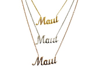 May include: Three necklaces with the name "Maui" in a cursive font. The necklaces are gold, silver, and rose gold, each with a delicate chain. The word "Maui" is the focal point of each necklace.