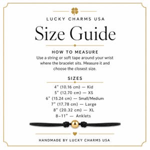 May include: A white size guide chart from Lucky Charms USA featuring black text and a gold clover icon. It provides instructions for measuring wrists and lists sizes from 4 inches to 11 inches for kids, adults, and anklets, with a gold bead bracelet.