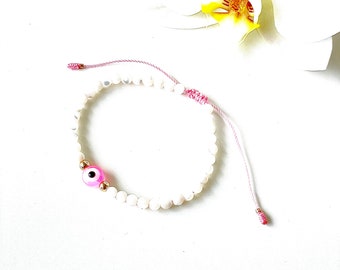 Selenite beads bracelet with pink evil eye on pink string and gold-filled accent beads