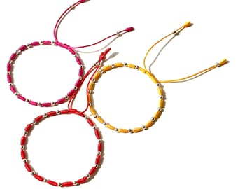 Beaded knots bracelets with silver balls and yellow red purple color strings in Limited edition