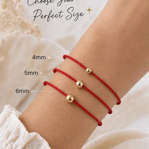 Lucky Charms USA red twisted cord bracelets with 4 mm, 5 mm, and 6 mm 14k gold-filled bead size options shown on a woman’s wrist.