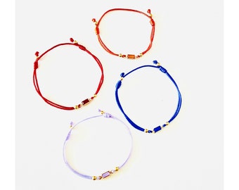 Crystal string bracelets in pink, blue, orange, red