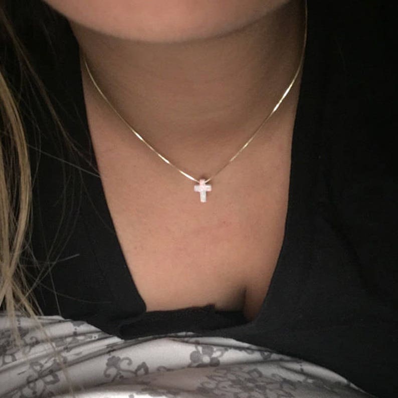 daughter is wearing white opal cross necklace handmade confirmation gift by Lucky Charms USA