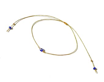 Thin and dainty evil eye bracelet on gold metallic string with gold-filled accent beads a minimalist gift for her