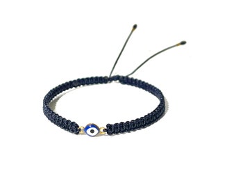 Navy blue style gold-filled evil eye on pretty blue string hand-braided bracelet with golden accent glass beads