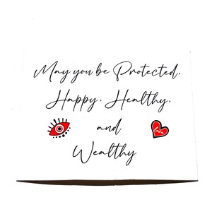 Lucky Charms USA Beautiful  Blessing Card with Heart and Evil Eye Design in White, Black, Red Colors that reads: May You Be Protected, Happy Healthy, And Wealthy.