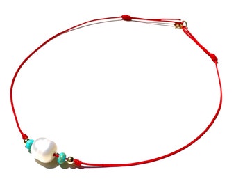 Beautiful large pearl with turquoise gems and shiny gold-filled accent balls on bright red string the perfect eye-catching choker necklace