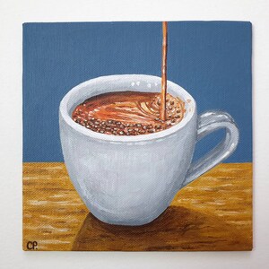 May include: A painting of a white coffee cup with coffee being poured into it. The coffee is a dark brown color, and the cup is sitting on a wooden surface. The background is a solid blue color.