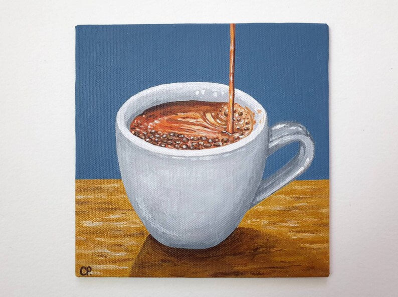 May include: A painting of a white coffee cup with coffee being poured into it. The coffee is a dark brown color, and the cup is sitting on a wooden surface. The background is a solid blue color.