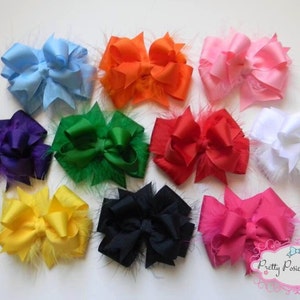 May include: Ten different colored hair bows with feather trim. The bows are made of satin ribbon and are tied in a double loop. The colors are purple, green, blue, orange, pink, red, white, yellow, black, and hot pink.