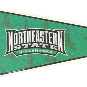 May include: A green pennant with the words "Northeastern State Riverhawks" in a white and black design. The pennant has a green background with eagle silhouettes and a white border.
