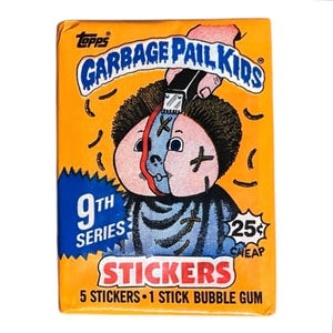 May include: A vintage Garbage Pail Kids sticker pack. The orange pack features a cartoon character with a split face, cross marks, and the text "9th Series" and "Stickers". The price is marked as 25¢.