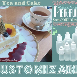 May include: A slice of cake with whipped cream, fruit, and raspberry sauce on a white plate. The cake is next to a cup of tea on a saucer. The image also shows a set of clear glass bottles with white caps labeled with different sizes in milliliters. The text "DESIGN YOUR OWN PERFUME" is at the top of the image. The text "Scent*Oil*Colour*Size" is below the text "DESIGN YOUR OWN PERFUME". The text "CUSTOMIZABLE" is at the bottom of the image.