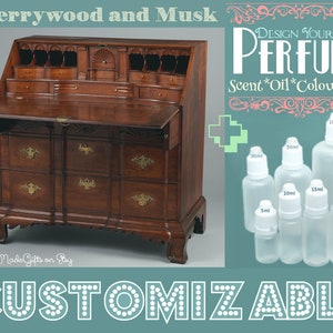 May include: A wooden desk with a drop-down front and multiple drawers. The desk is made of cherrywood and has a dark brown finish. The desk is in front of a white background. The image also shows a set of six clear glass bottles with white caps. The bottles are labeled with different sizes in milliliters. The text "DESIGN YOUR OWN PERFUME" is written in a decorative font above the bottles. The text "Scent*Oil*Colour*Size" is written below the bottles. The text "CUSTOMIZABLE" is written in a large font at the bottom of the image.