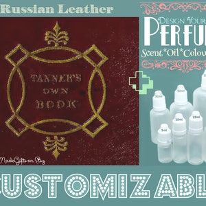 May include: A red book with gold lettering that reads "Tanner's Own Book" and the words "Russian Leather" at the top.  The book is next to a set of clear glass bottles with droppers, labelled with different sizes in millilitres. The bottles are labelled "Design Your Own Perfume" and "Scent*Oil*Colour*Size".