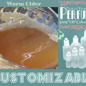 May include: The image features a glass of warm cider and a collection of customizable perfume bottles. The bottles come in various sizes, including 3ml, 5ml, 10ml, 15ml, 20ml, 50ml, and 100ml. The text on the image reads "Design Your Own Perfume" and "Customizable."